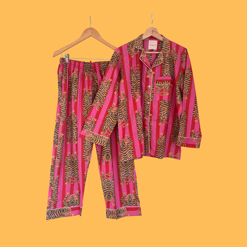 JP&Co. Pink & Red Striped Tiger Pyjamas Full Length on orange background
